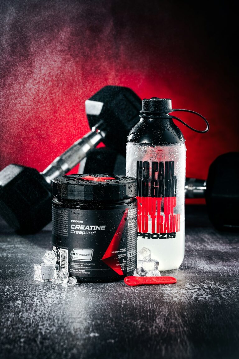 Creatine supplement with dumbbells and water bottle - best creatine for lifters 2026
